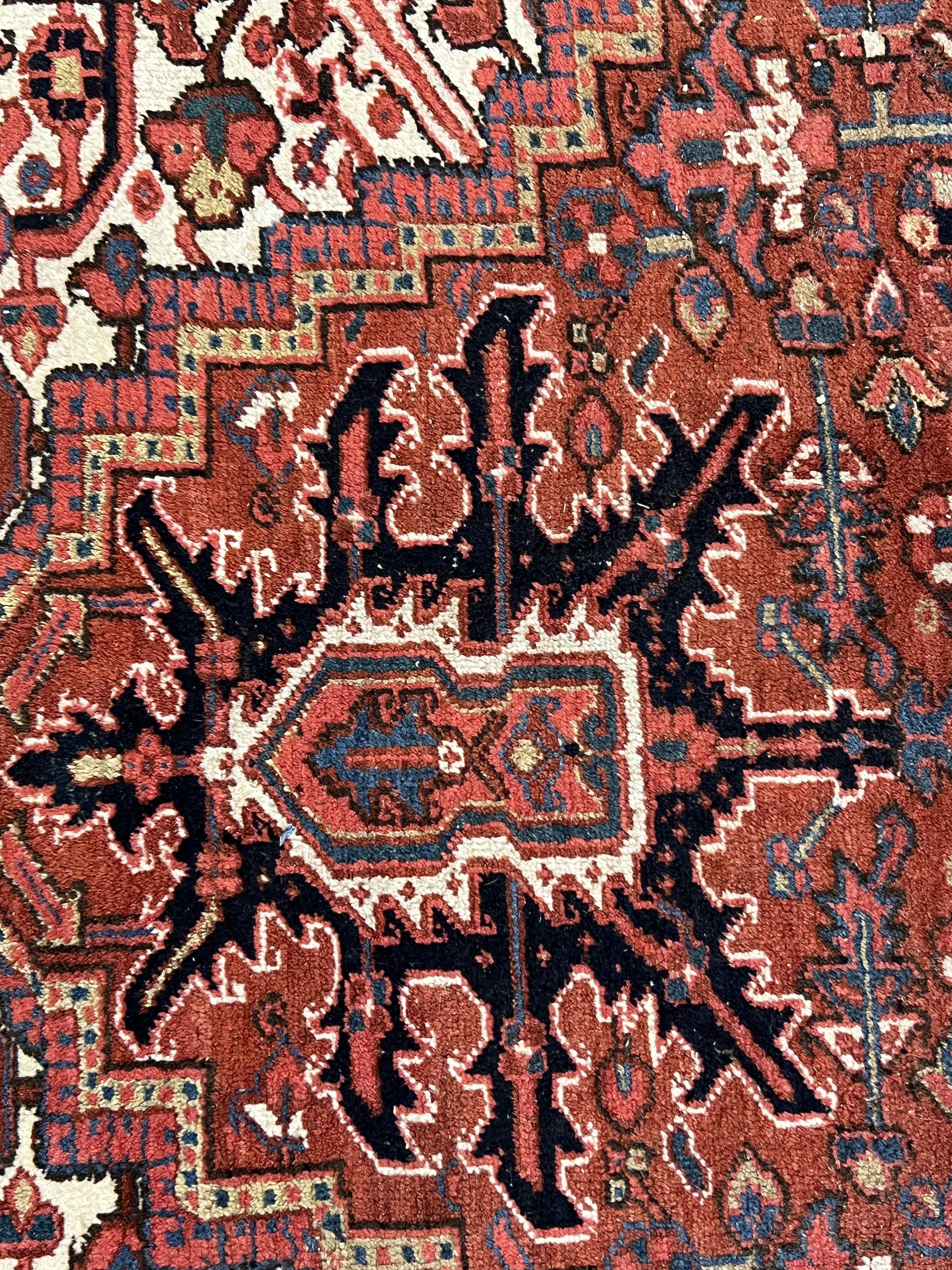 An antique Heriz carpet, 410 x 295cm